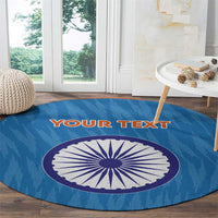 Blue round cricket rug with central India-style wheel graphic and orange side stripes