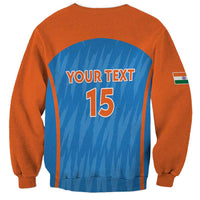 Unisex cricket sweatshirt, orange back with blue arch, Your Text and number 15