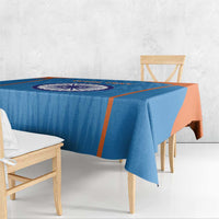 Blue cricket tablecloth with orange border and centered India emblem, table edge drape