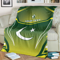 Green Pakistan flag blanket with white crescent moon, stars, and yellow custom text.