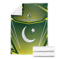 Green Pakistan cricket blanket folded with crescent moon, stars, and custom text, white edge.