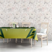Green custom cricket tablecloth with geometric pattern and star/crescent motif on table