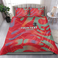 Red custom football bedding set with camo pattern, two matching pillowcases, logo badge.