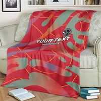 Red and teal football blanket spread out with YOUR TEXT WARRIORS print and emblem