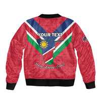 Red bomber jacket back with Namibia flag triangle, crest, and YOUR TEXT personalization