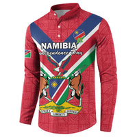 Red button-front sweatshirt with Namibia Independence Day text and crest flag graphic