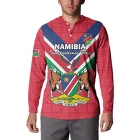 Red button-front sweatshirt with Namibia Independence Day crest, flag-map banner, and collar