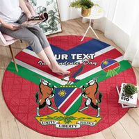 Red round rug featuring Namibia flag map, coat of arms, and Unity Liberty Justice text