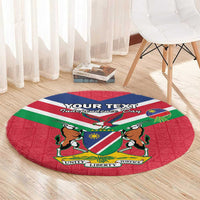 Red round rug with Namibia flag and coat of arms, Unity Liberty Justice at bottom