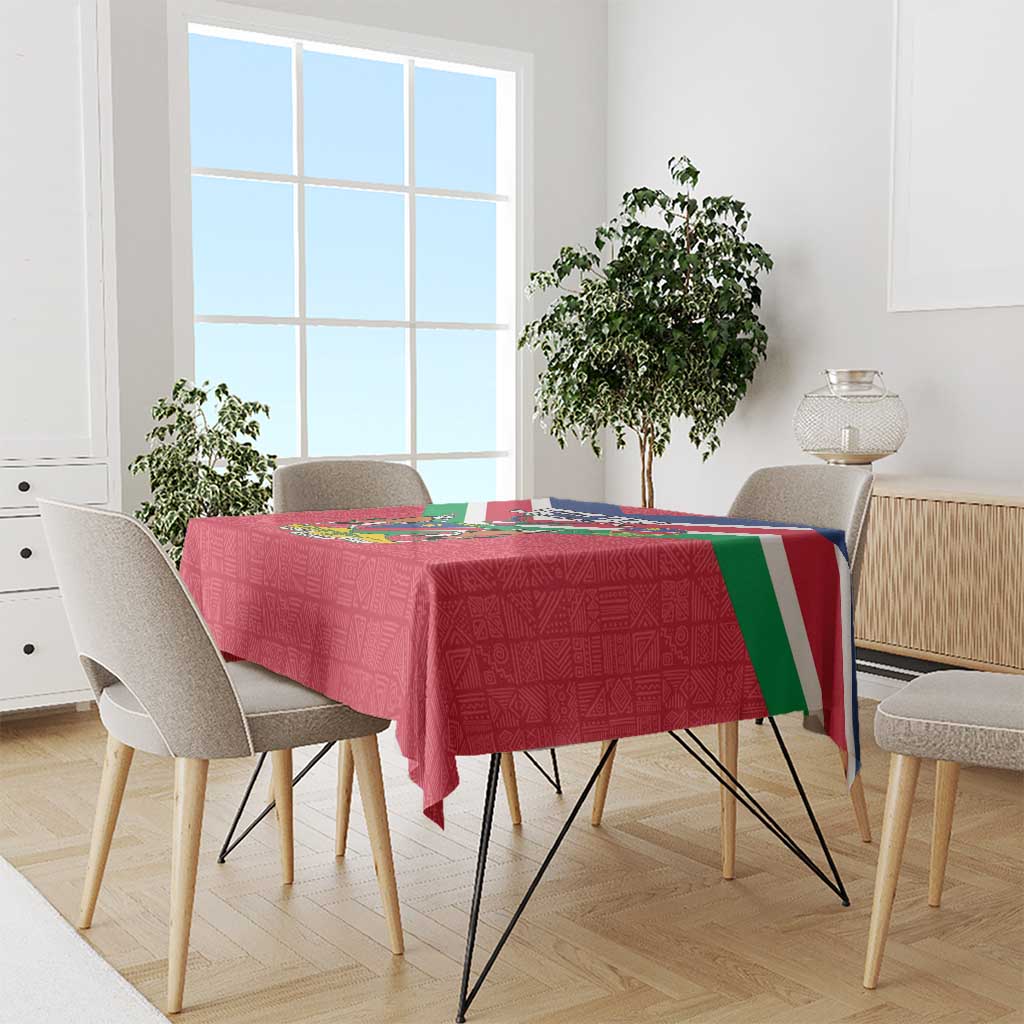 Red Independence Day tablecloth with Namibia flag stripe and coat of arms on dining table