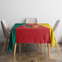 Cameroon national day tablecloth with lion coat of arms, red and yellow draped over table