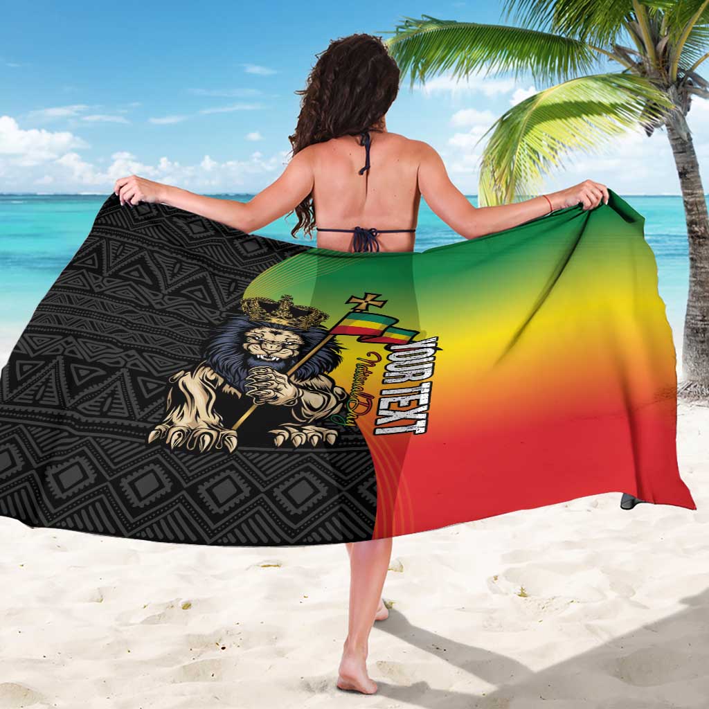 Black sarong with green-yellow-red gradient panel and Lion of Judah emblem