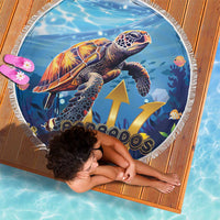 Round beach blanket featuring sea turtle artwork, yellow arrows, and white fringed border