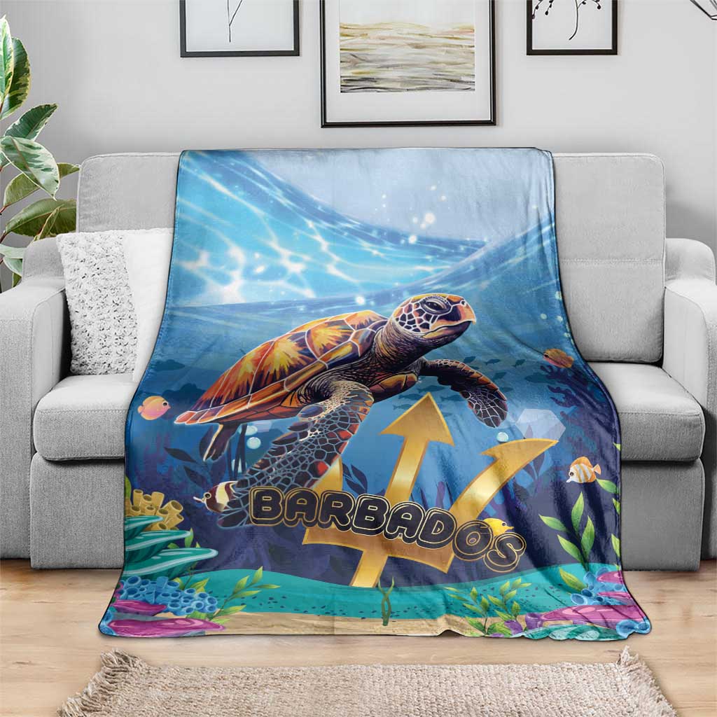 Blue sea turtle throw blanket with underwater plants and gold emblem on sofa