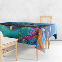 Blue ocean sea turtle tablecloth draped over table, multicolor coral and marine print