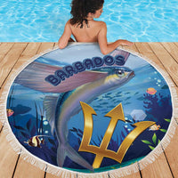 Round blue ocean-style beach blanket featuring a flying fish design with white fringe border