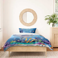 Blue bedding set with flying fish, Barbados text, and large gold crest on duvet