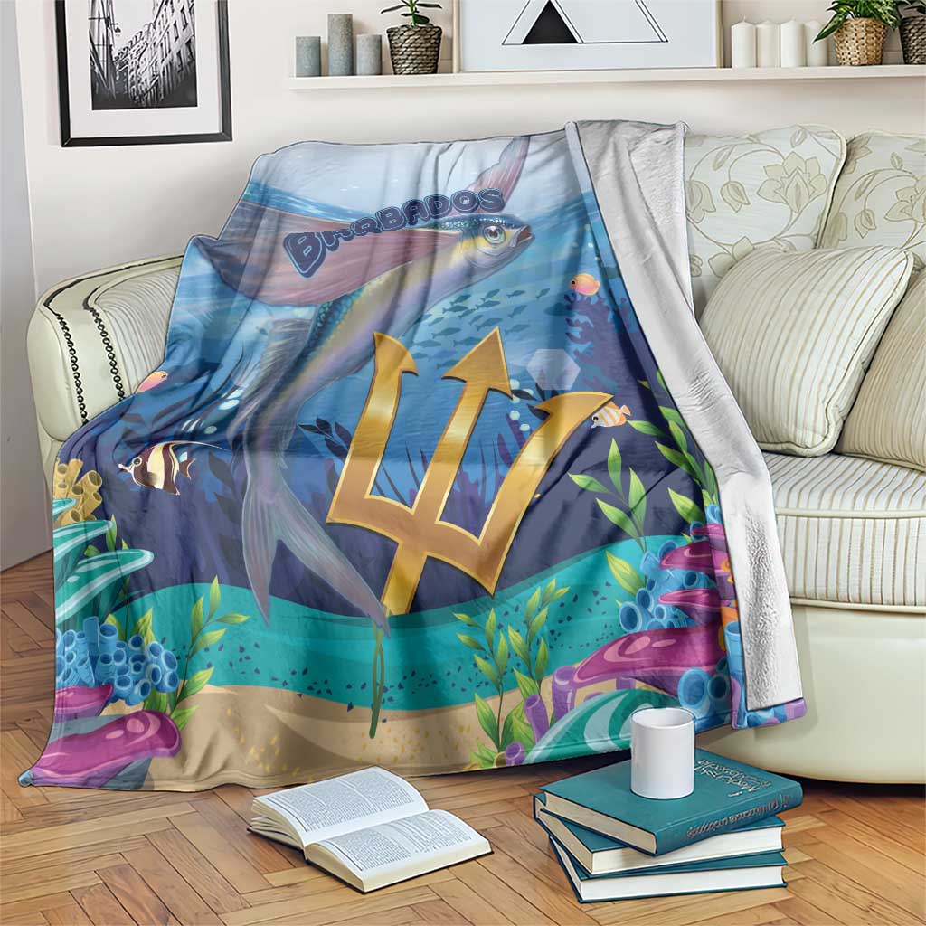 Blue ocean-themed blanket with flying fish and gold crest on a soft throw