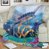Blue ocean flying fish blanket on a cream couch, gold crest with sea plants