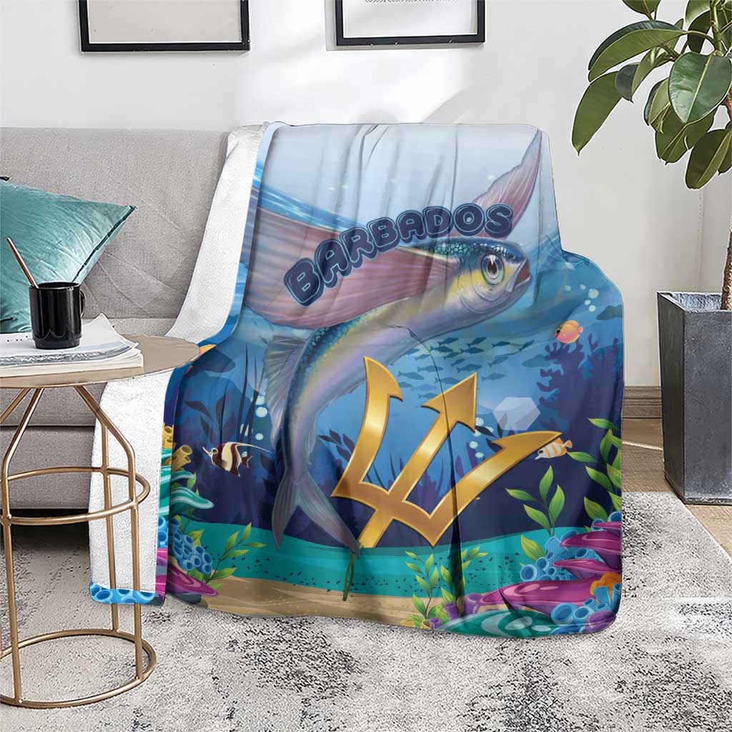 Blue flying fish blanket on a gray sofa, gold crest and reef details