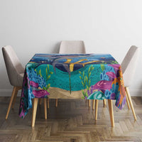 Rectangular ocean tablecloth with underwater sea-life artwork over a dining table and chairs