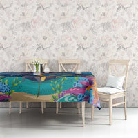 Underwater reef printed tablecloth in blue, purple, and green on a long dining table
