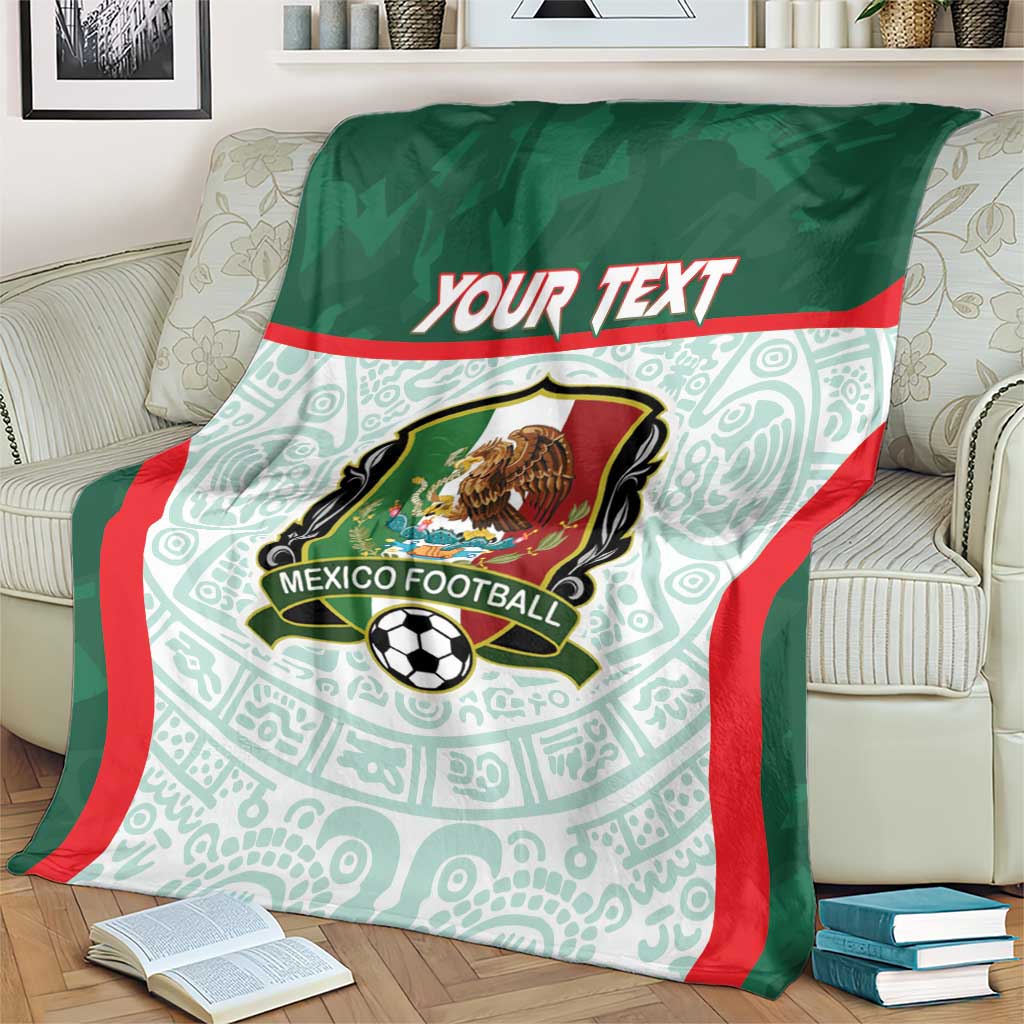 Green football blanket with Mexico crest and 'Your Text', red-trimmed sides on sofa