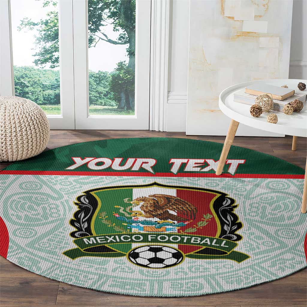 Green round carpet with Mexico football crest and soccer ball over light teal Aztec pattern
