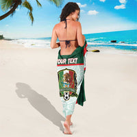 Green Mexico football sarong with aztec pattern, draped around body from back