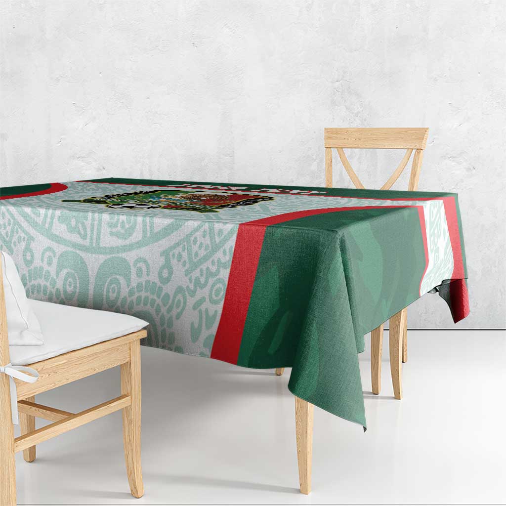 Green and aqua Mexico football tablecloth with red trim over dining table