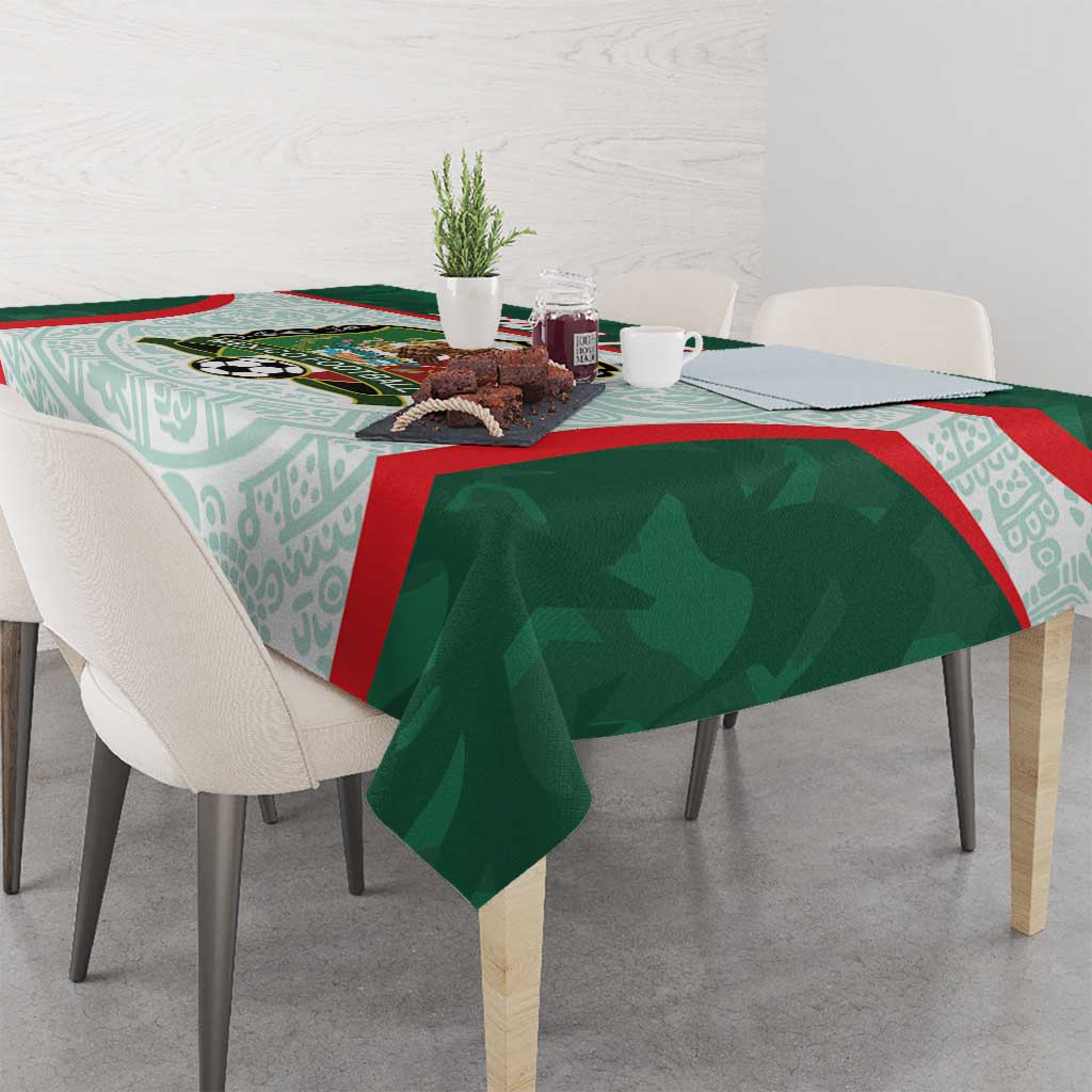 Green Mexico football tablecloth with aqua patterns and red stripe at table edge