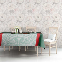 Green and aqua Mexico football tablecloth with Aztec-style motifs and red stripe