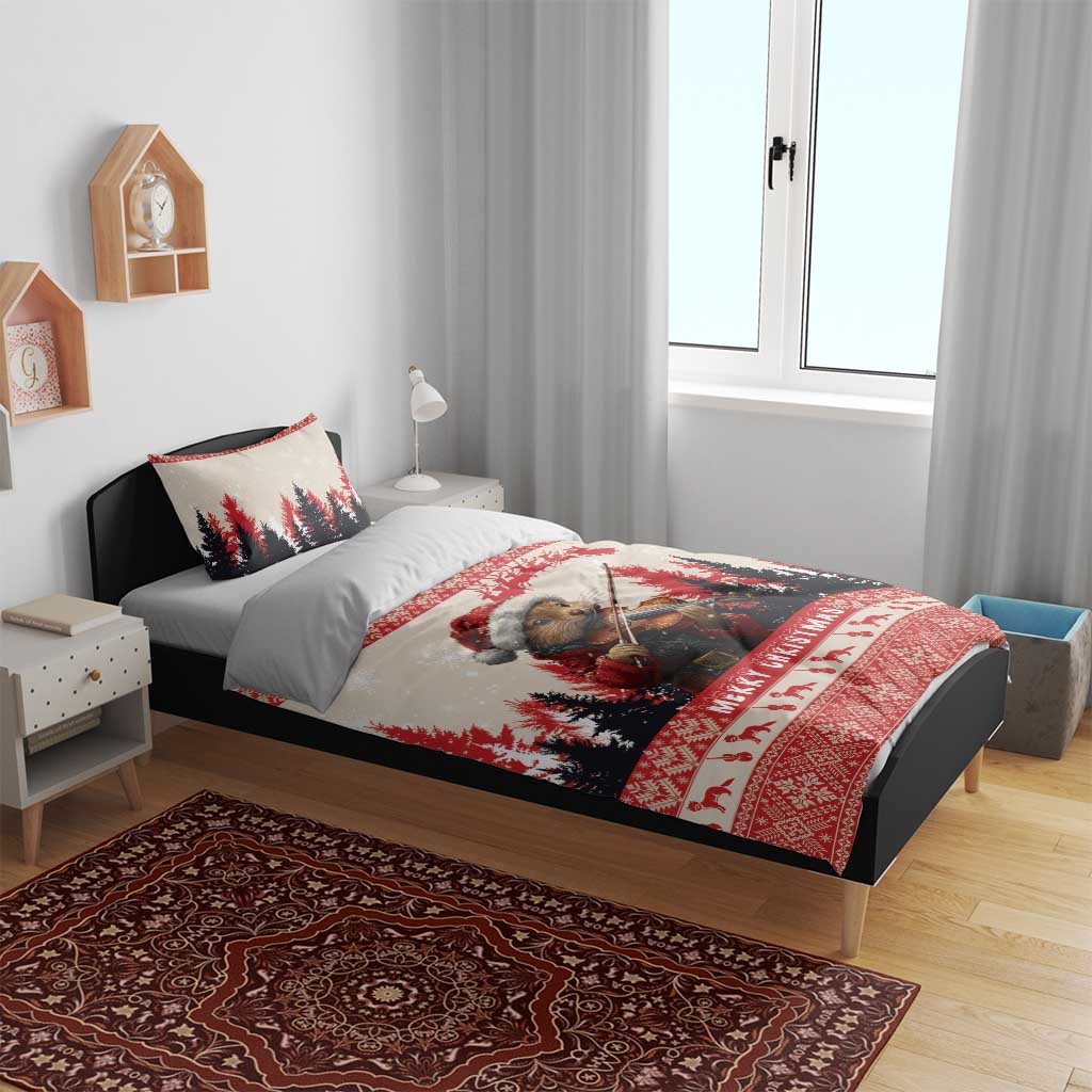 Christmas bedding set on bed with two pillows; pine marten playing violin and red “Merry Christmas”