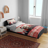 Christmas bedding set on bed with two pillows; pine marten playing violin and red “Merry Christmas”