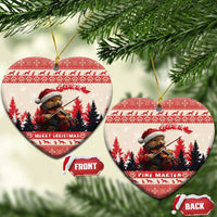 One round and one heart-shaped red-and-white ceramic Christmas ornament with pine marten playing violin