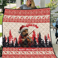 Red Christmas quilt featuring a pine marten playing violin with pine trees and 'Merry Christmas'.