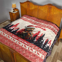Red Christmas quilt laid on a wooden bed, showing a pine marten playing violin and 'Merry Christmas'.
