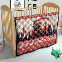 Red Christmas quilt on a wooden crib, featuring pine marten playing violin with pine trees.