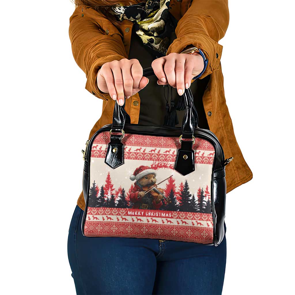 Red and black Christmas patterned shoulder handbag with dual top handles and metal studs