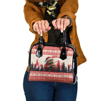 Red and black Christmas patterned shoulder handbag with dual top handles and metal studs