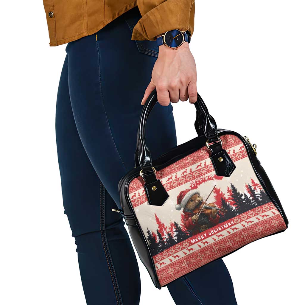 Red and black Christmas handbag with black handles, zipper top, and crossbody strap