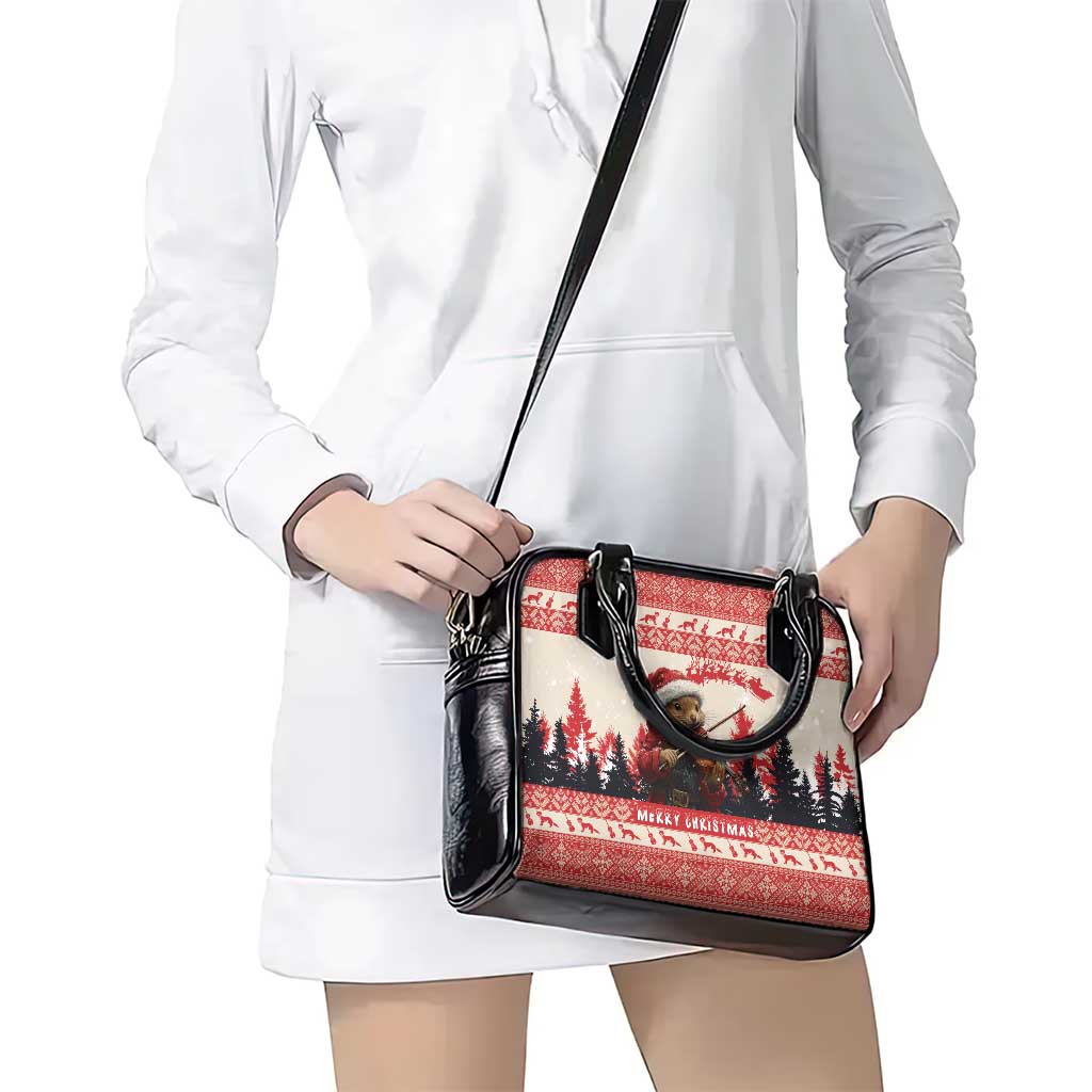 Red and black Christmas handbag with crossbody strap worn over white dress, front view