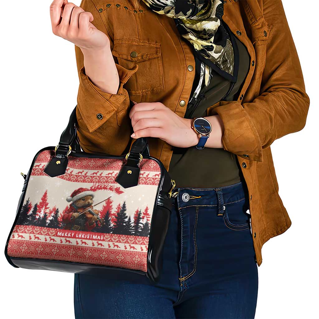 Red and black Christmas patterned handbag on shoulder with dual handles and zipper front