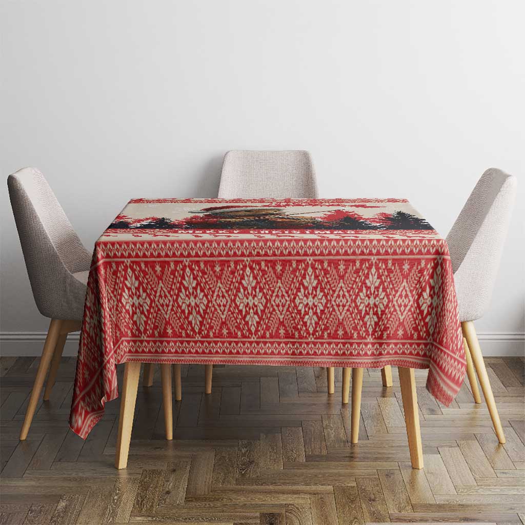 Red Christmas tablecloth with repeating diamond pattern and fringe corner detail