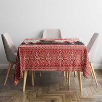 Red Christmas tablecloth with repeating diamond pattern and fringe corner detail