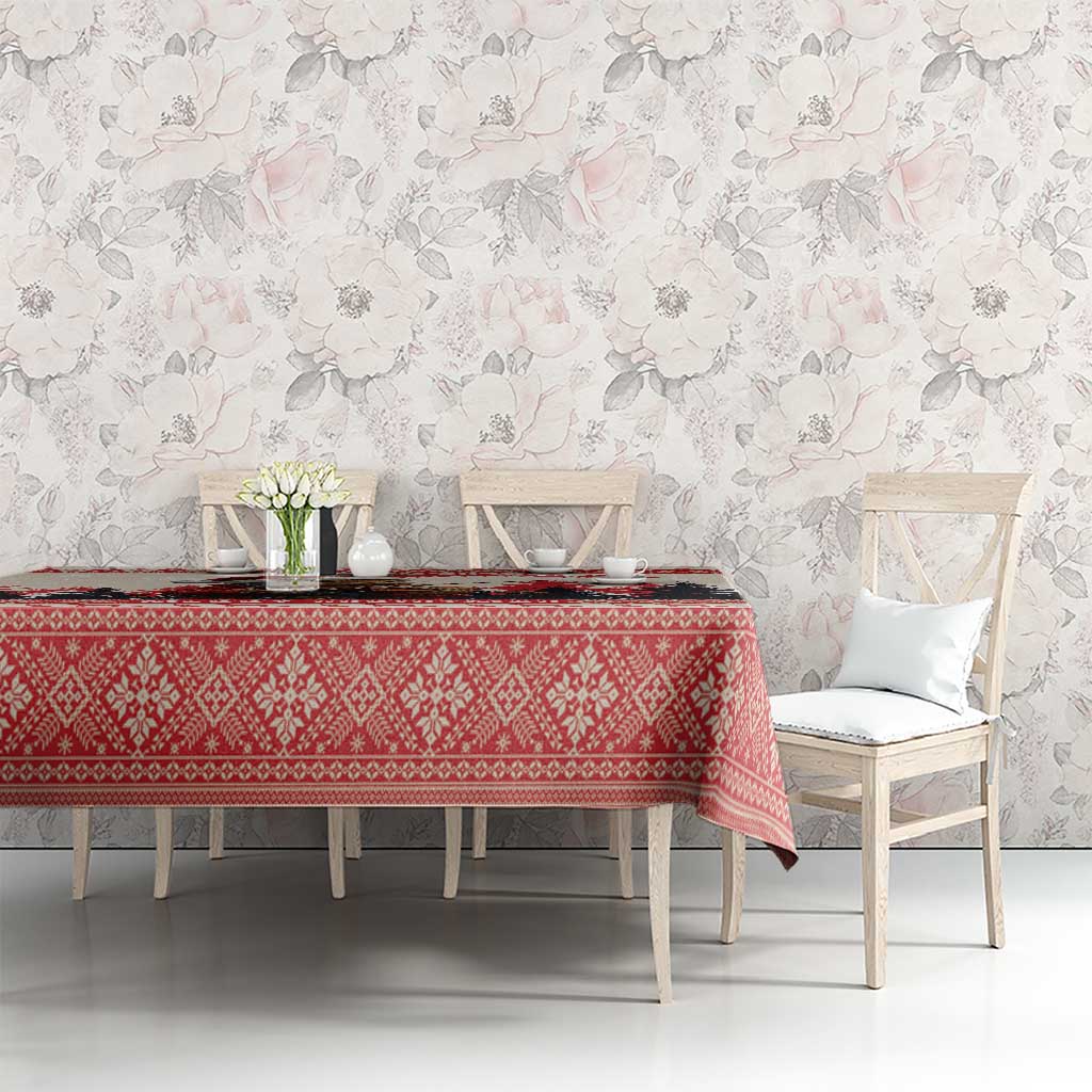 Red Christmas tablecloth with diamond pattern over rectangular dining table