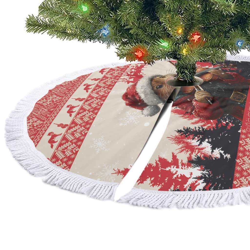 Round Christmas tree skirt with white fringe edge, red and white marten violinist graphic