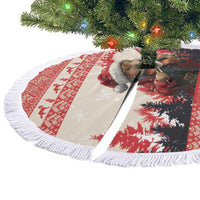 Round Christmas tree skirt with white fringe edge, red and white marten violinist graphic