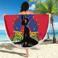 Round fringed beach blanket with Haiti flag graphic and central statue illustration