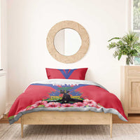 Personalized bedding set with red and blue flag artwork, YOUR TEXT, palm tree silhouette and hibiscus